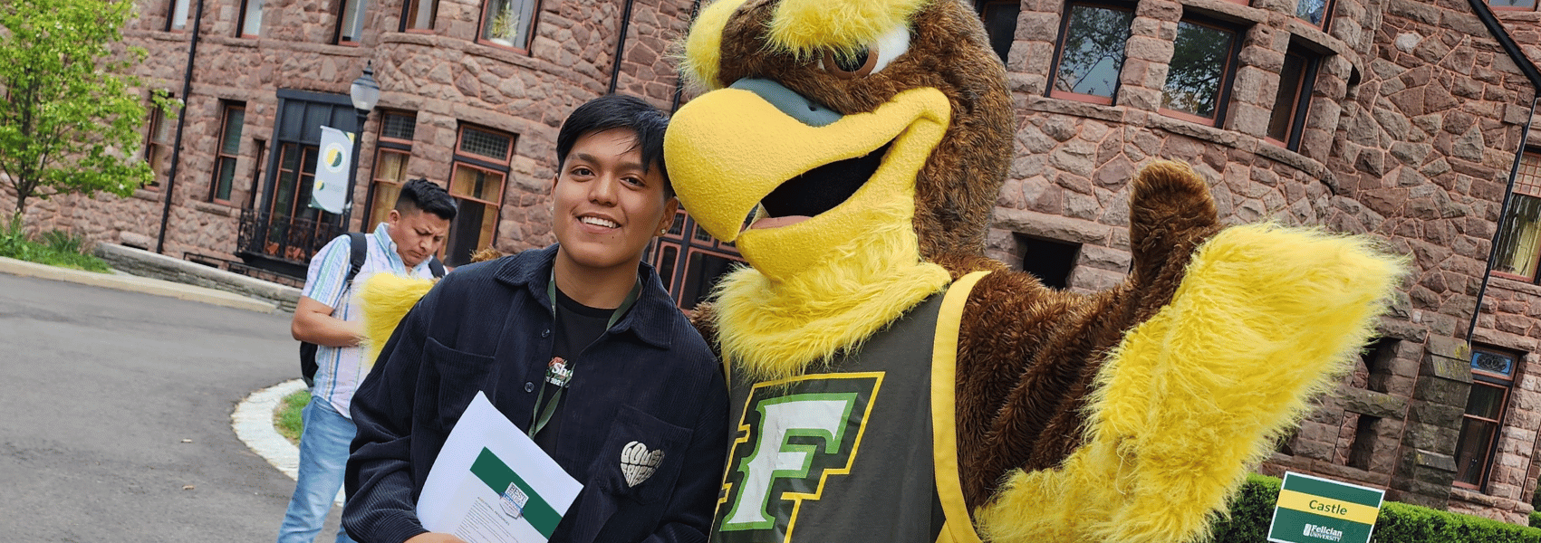 Franke with a student outside of the castle on the Rutherford campus