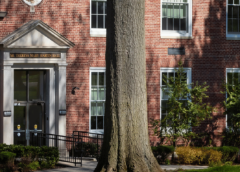 Female walking Into building on Rutherford campus