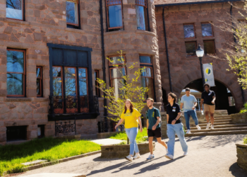 Students walking infant of castle on Rutherford