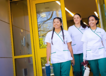 Three Female nursing Students Exiting building