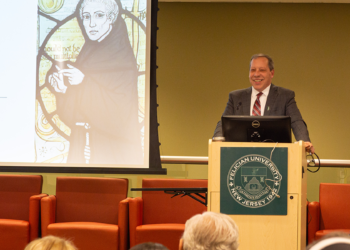 bob clougherty talking at podium at the Institute for Information Sciences Launch