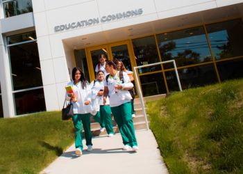 Nursing students walking outside of education commons