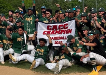 Baseball team picture holding up CACC Championship banner