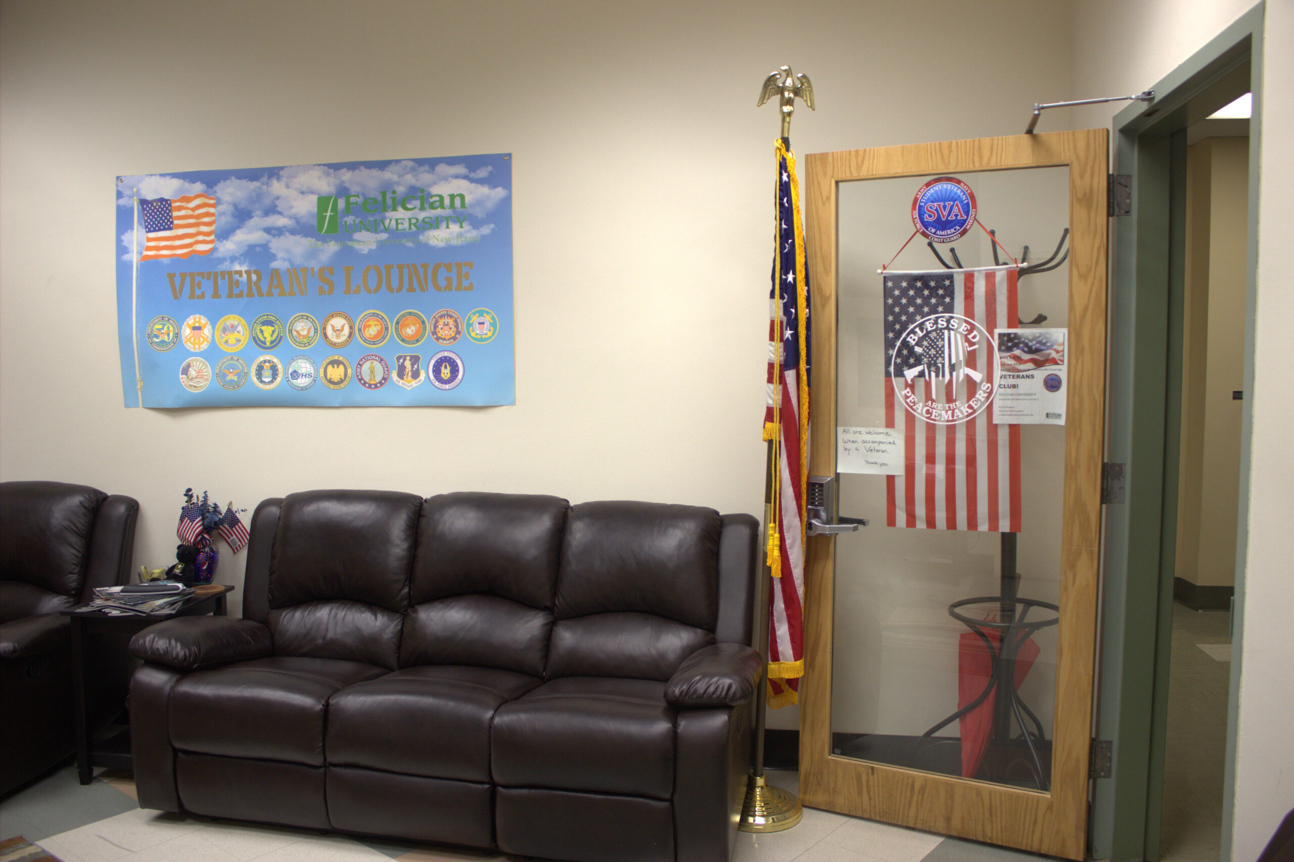 veteran's lounge with couches and a flag