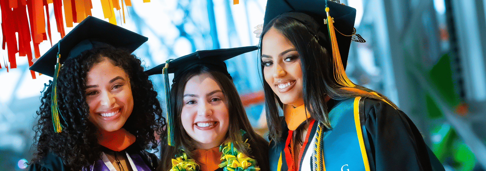 Three Female students in cap and gown