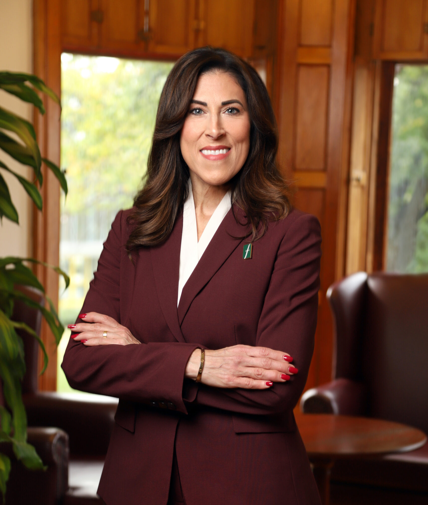 Dr. Mildred Mihlon, president of Felician university, in a maroon colored suit.