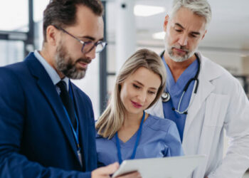 Pharmaceutical sales representative talking with doctors